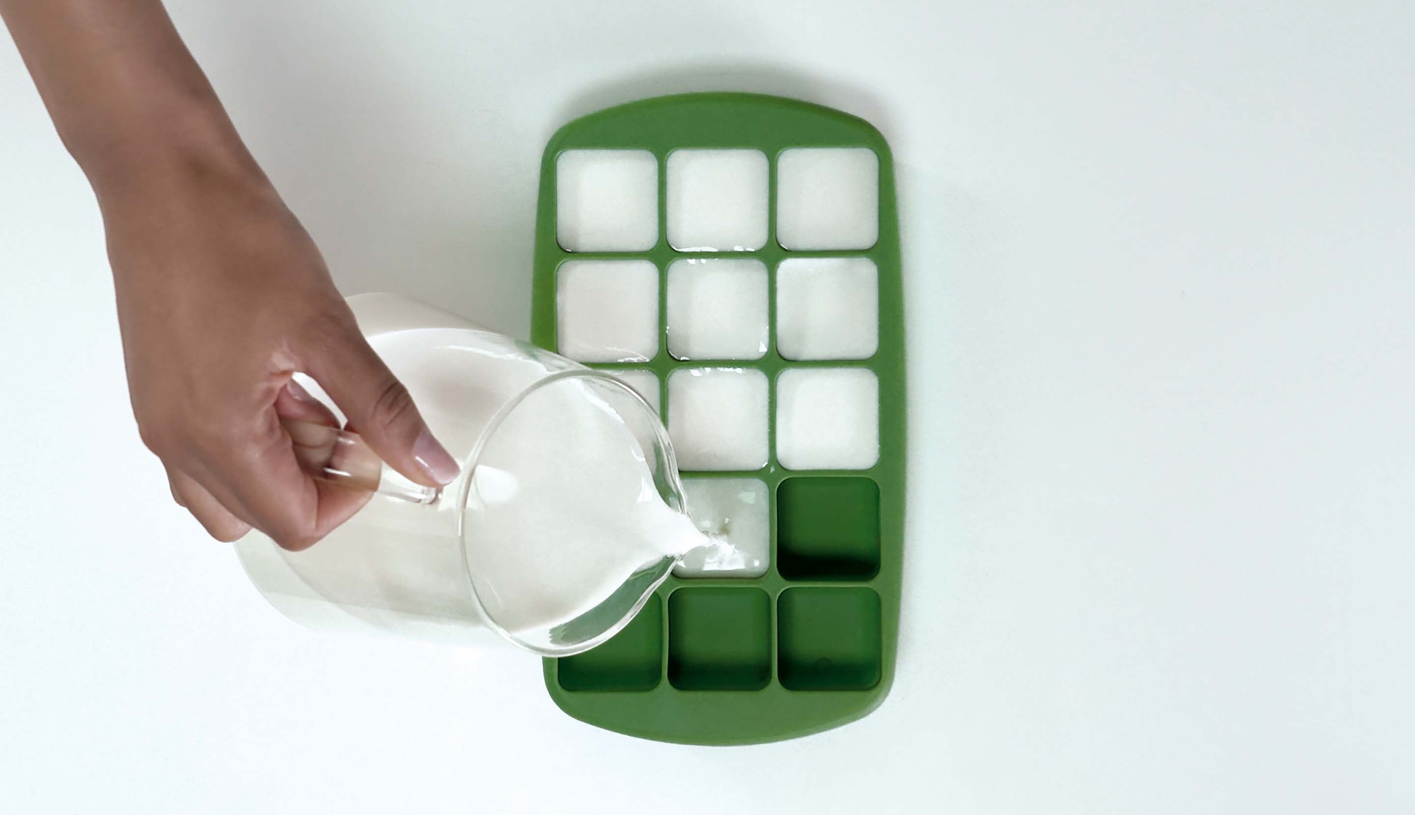 Pouring Milk on Ice Tray