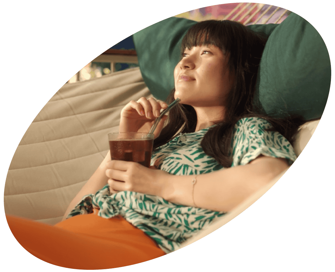 a girl with a glass of iced coffee