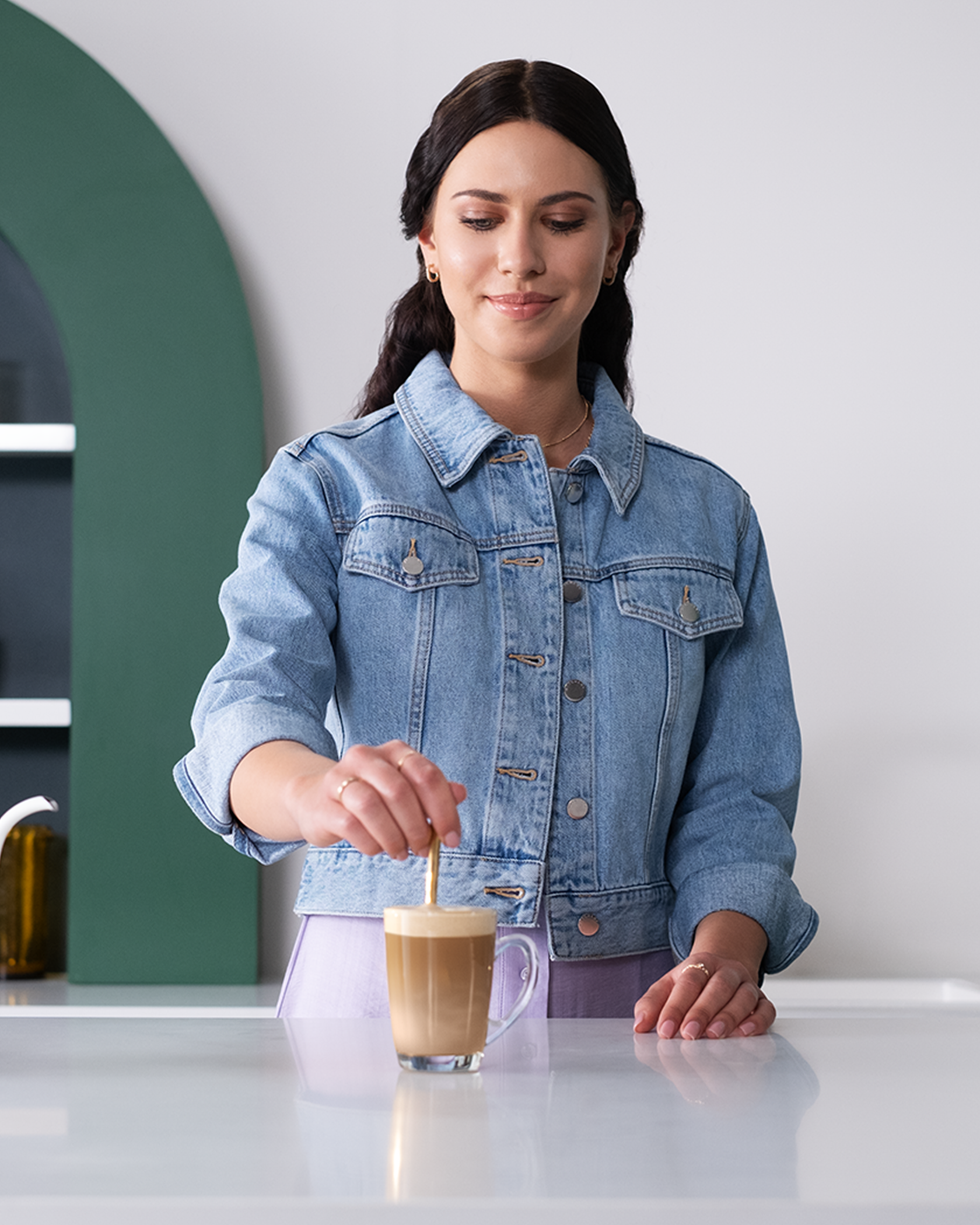 Woman making Starbucks® Vanilla Latte Premium Instant