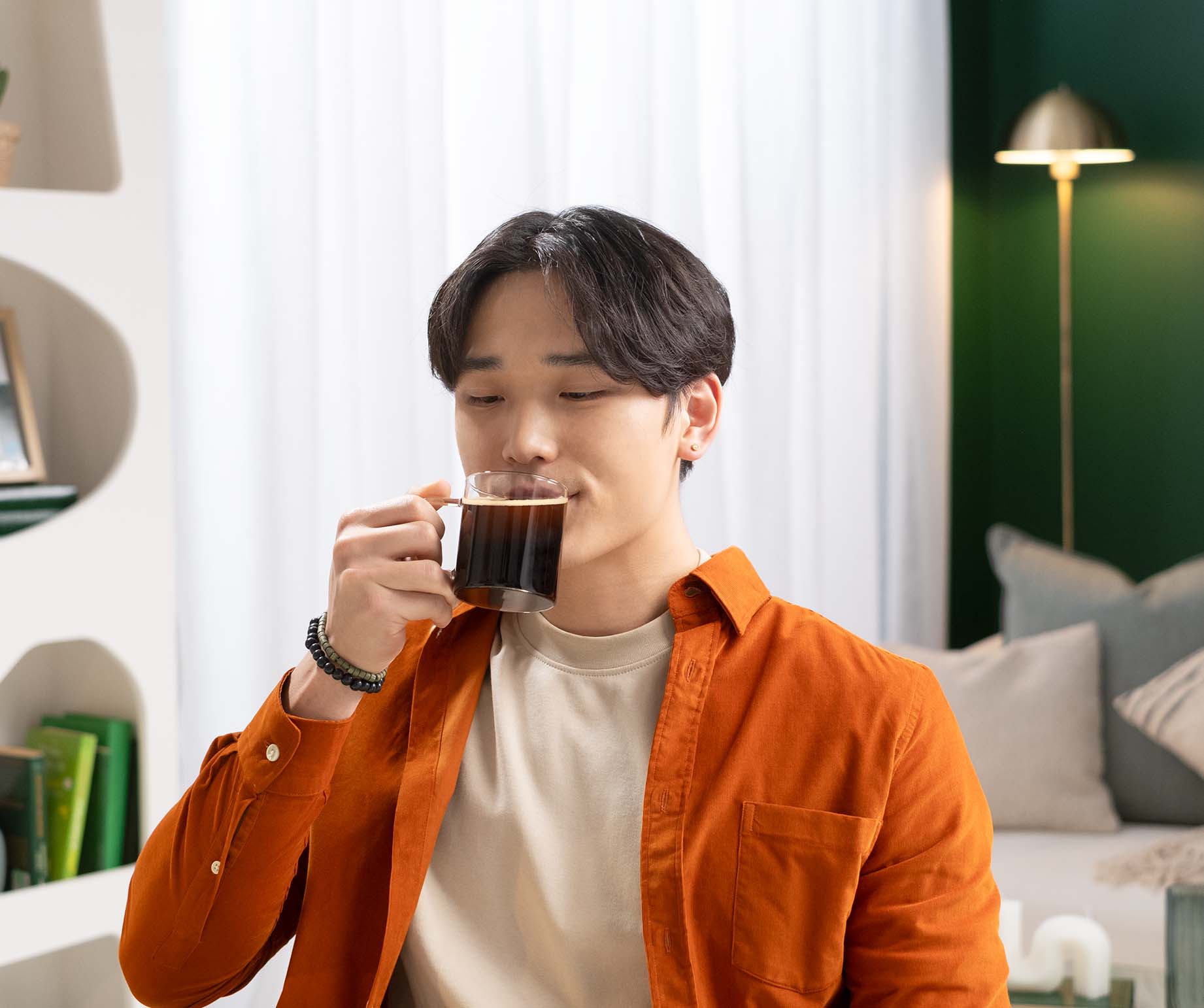 Man enjoying Starbucks® Premium Instant Coffee Dark Roast