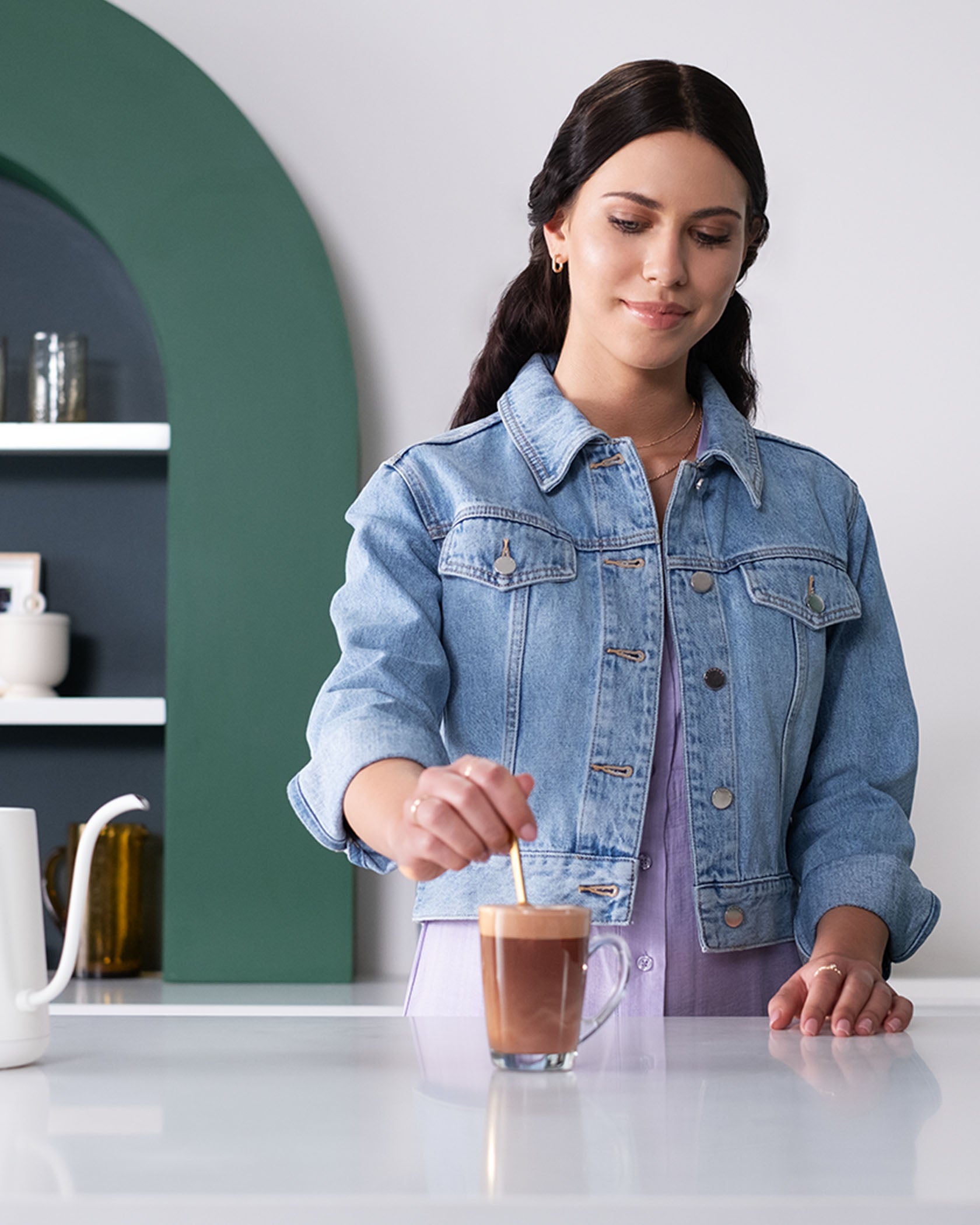 Woman making Starbucks® Caffè Mocha Premium Instant