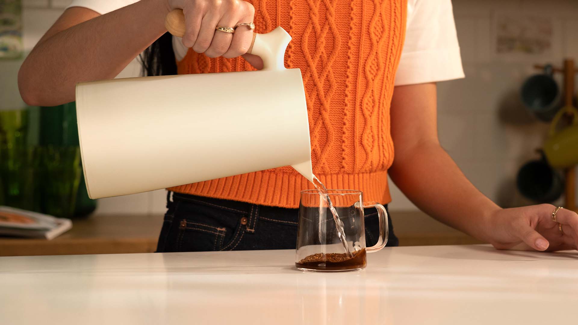 Pouring hot water onto soluble coffee in a glass