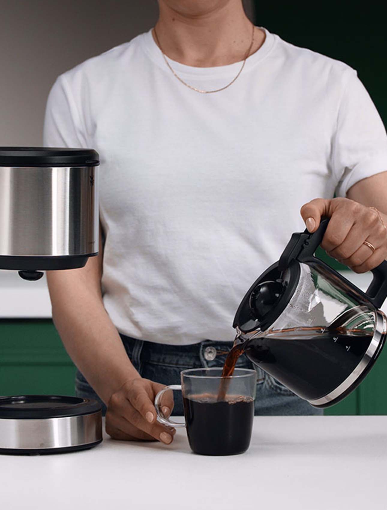 Pouring fresh coffee into a cup