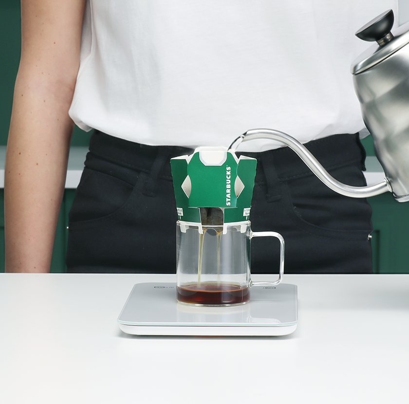 Using the gooseneck kettle, slowly pour in 30-40g of hot water over the coffee grounds. 
