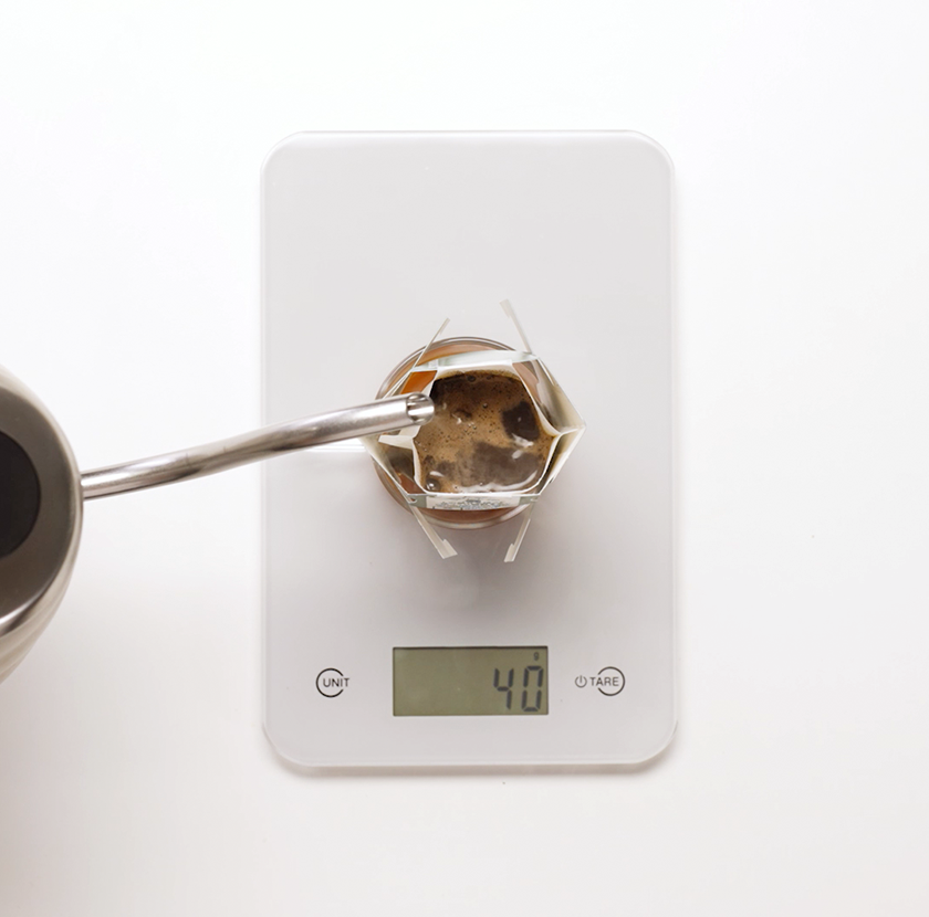 Let it steep, allowing the coffee to bloom for 20-30 seconds. 