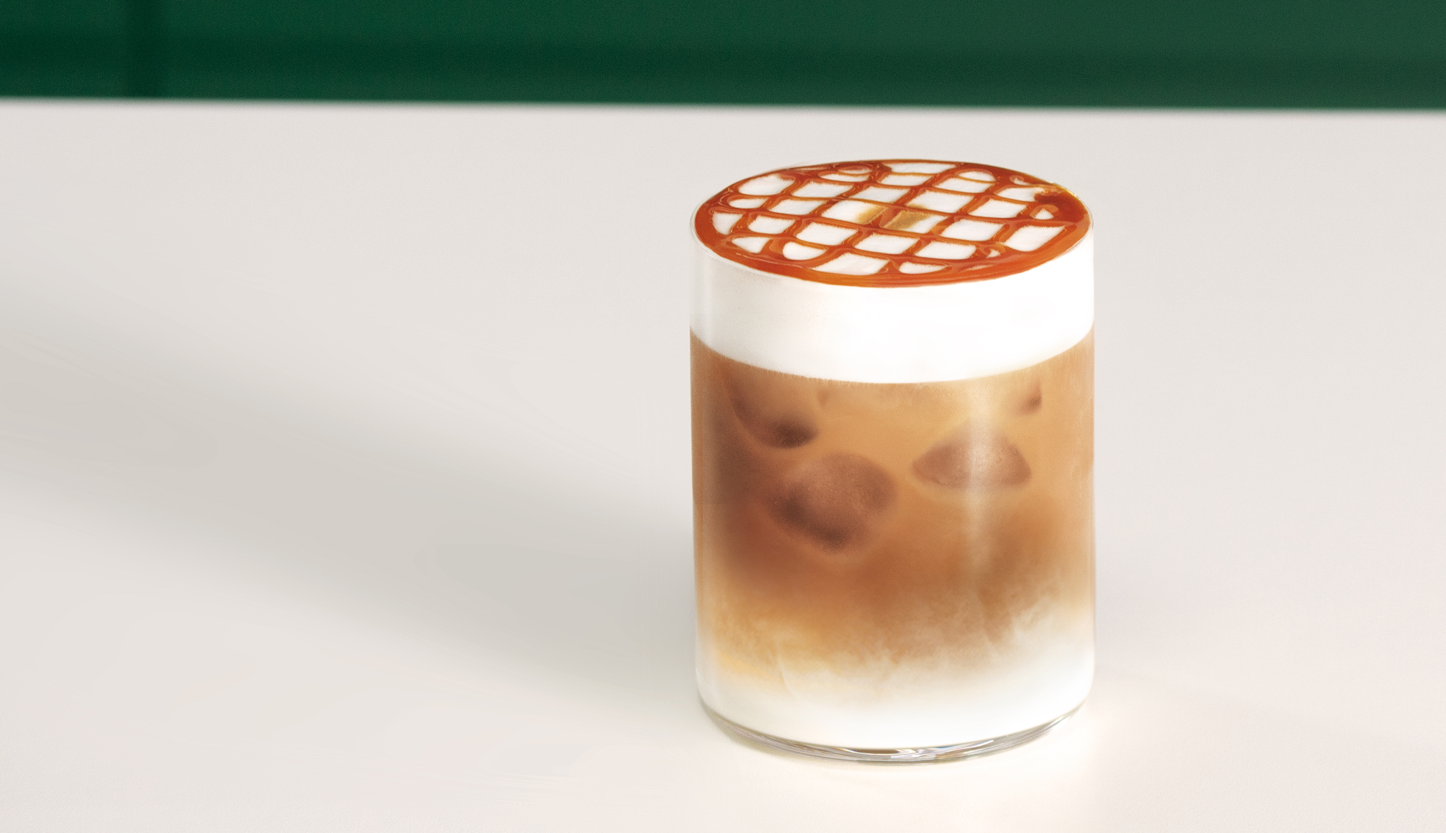 Iced Starbucks® coffee topped with a caramel lattice.