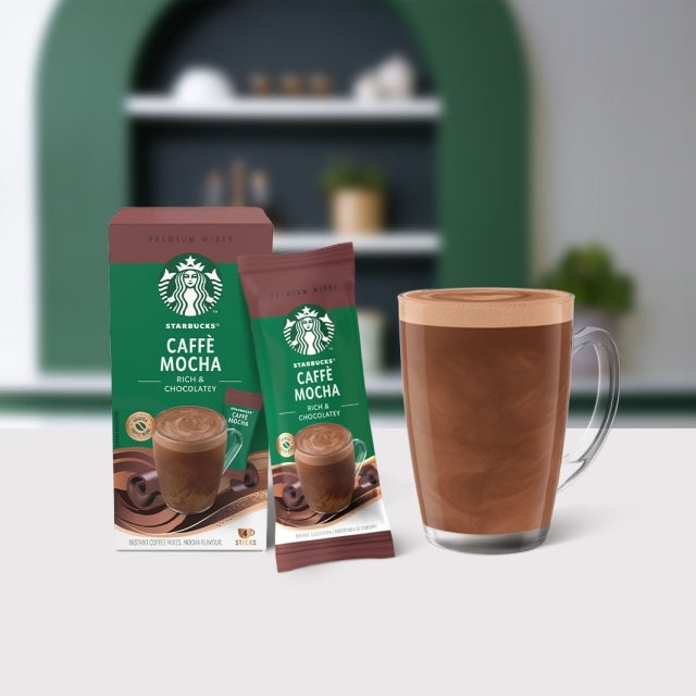 Starbucks® Caffè Mocha Premium Instant Coffee package next to a coffee glass