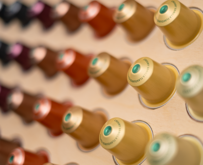 Brewing cabinet full of coffee capsules, roast coffee and accessories
