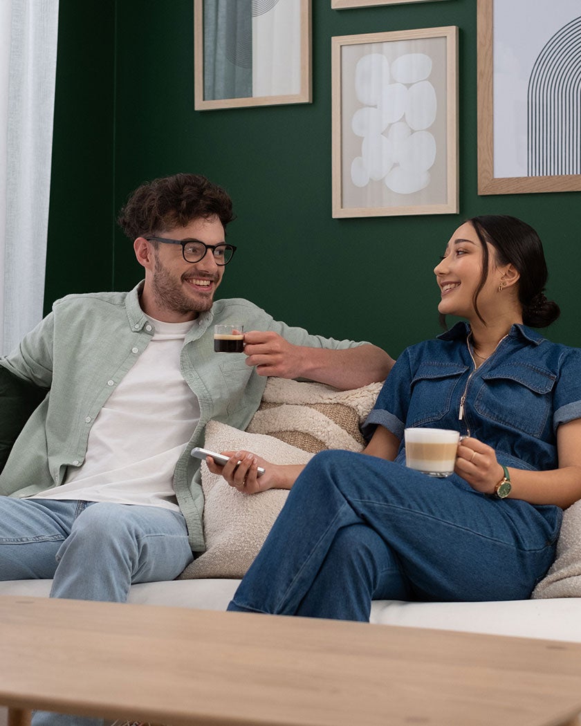 two people drinking coffee